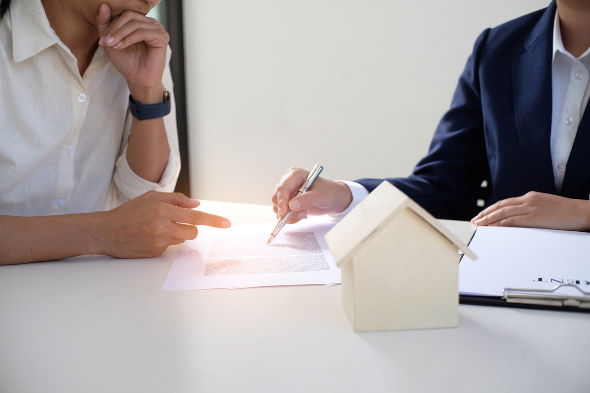 Sales manager giving advice application form document, consideri